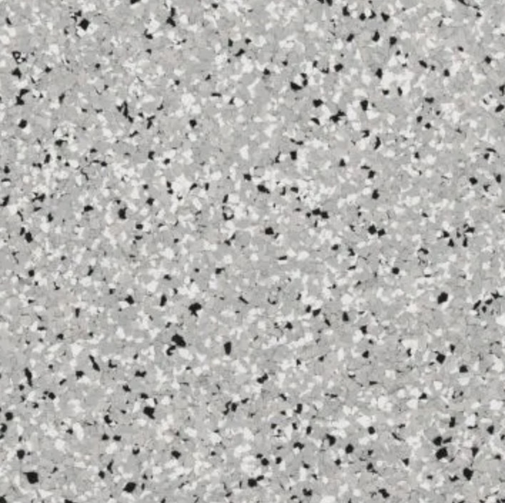 Clean and organized workshop with tools, workbench, metal tool chest, and industrial equipment including compressors and a drill press.