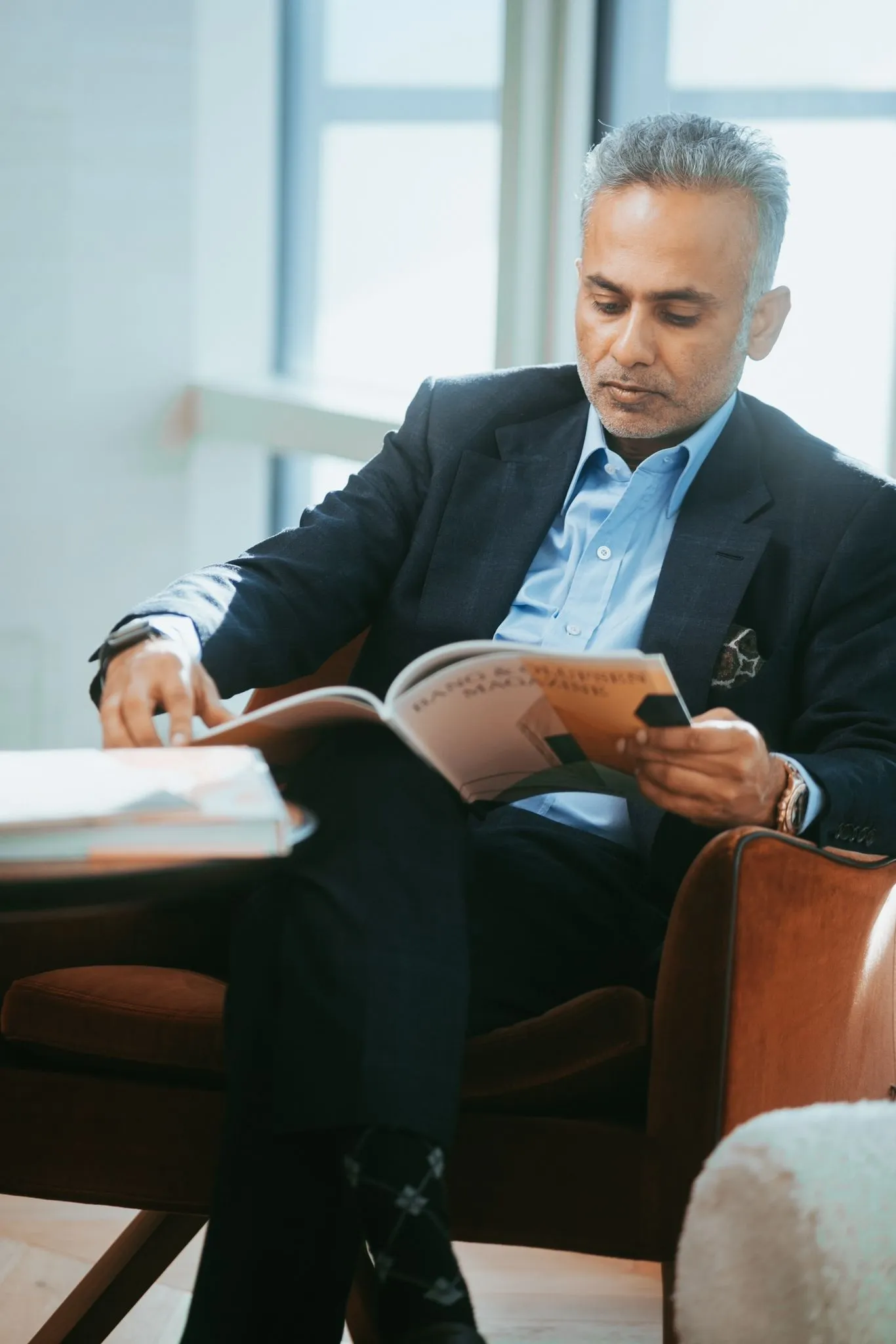 Sayan Navaratnam, founder and CEO of The Malar Group, reviewing business documents