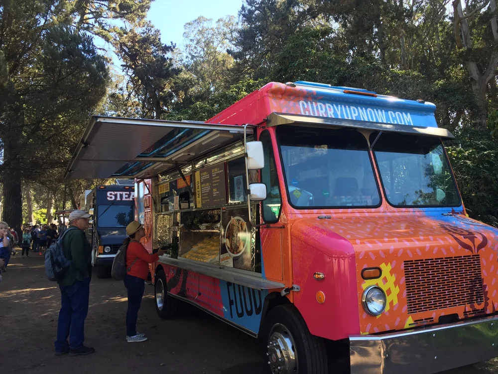  Curry Up Now Indian street food truck serving guests at a Bay Area event