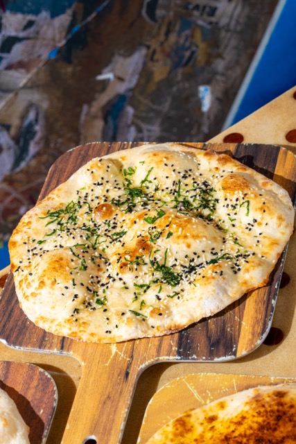 Sesame Onion Seed Naan at Curry Up Now