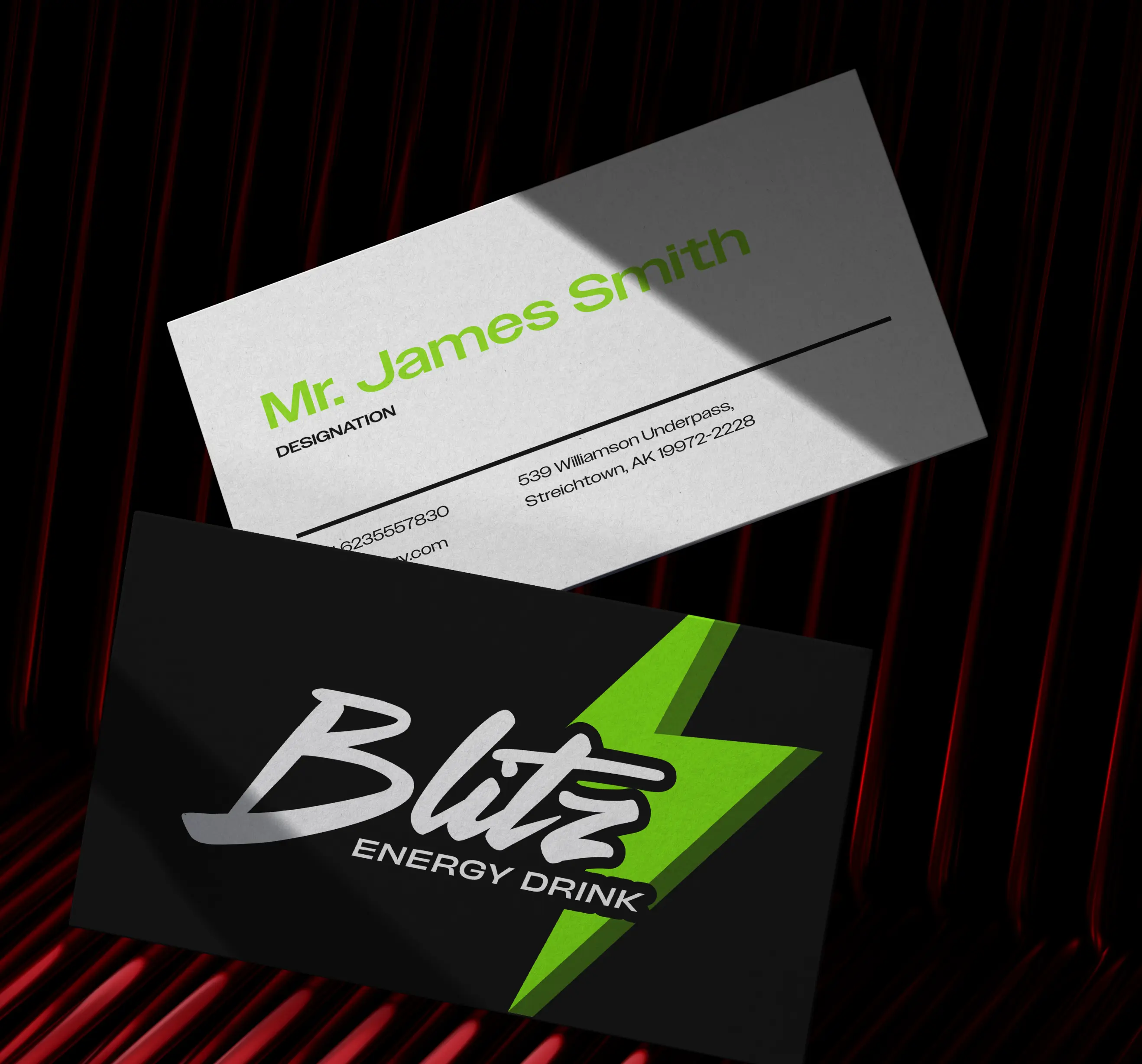 Two business cards on a red and black background; one white card shows contact info for Mr. James Smith, the other black card displays Blitz Energy Drink logo with a green lightning bolt.