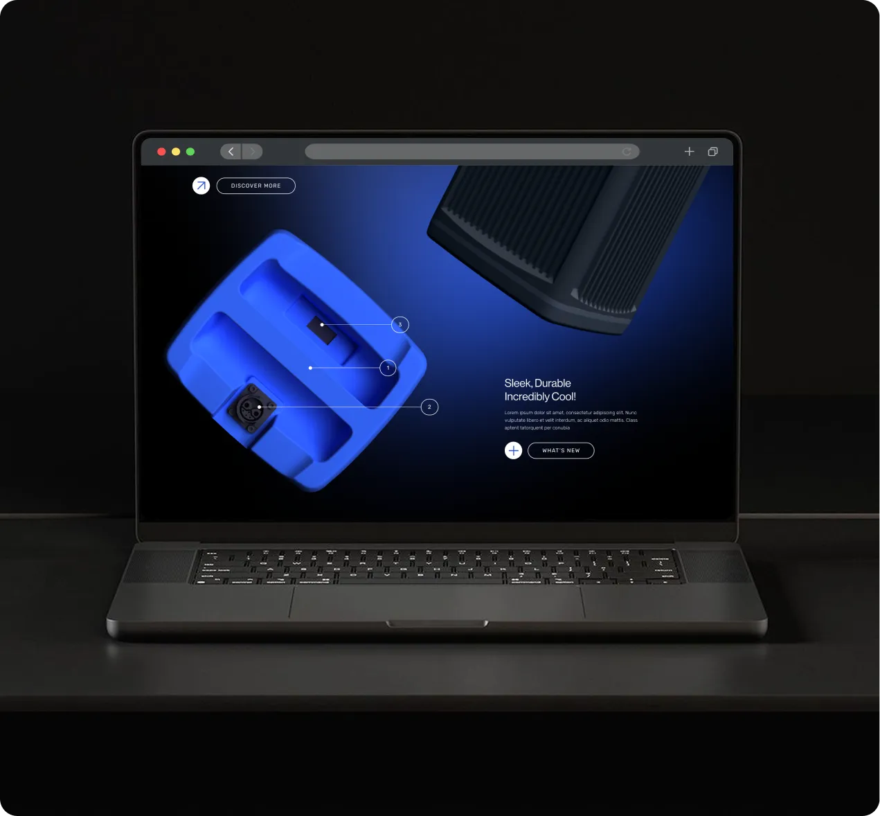 Laptop on a dark surface displaying a website with blue and black product images and text reading 'Sleek, Durable Incredibly Cool!' alongside buttons for 'Discover More' and 'What's New'.