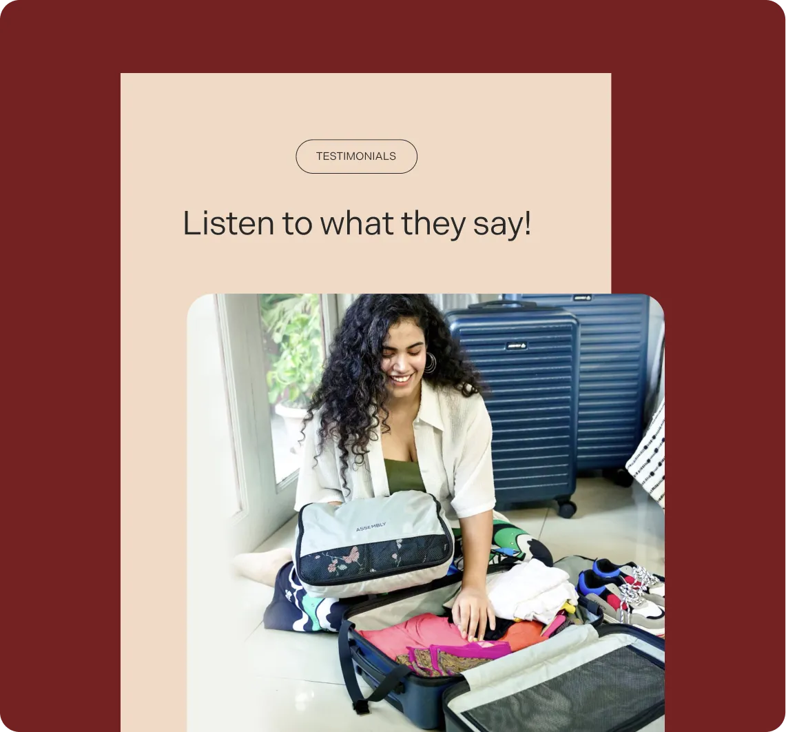 A smiling woman with curly hair packing colorful clothes into a suitcase with packing organizers, surrounded by other luggage and shoes.