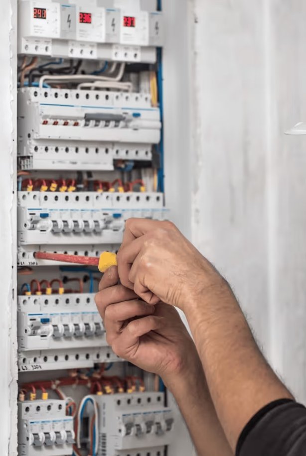 Electrician performing a residential switchboard upgrade in the Southern Highlands NSW