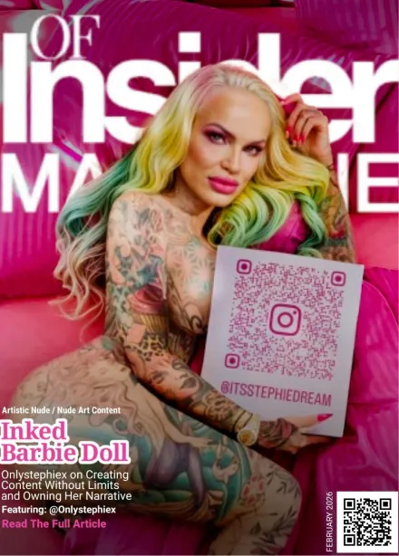 Blonde woman with tattoos wearing a tight pink dress standing on a sunny street with palm trees and a pink car behind her.