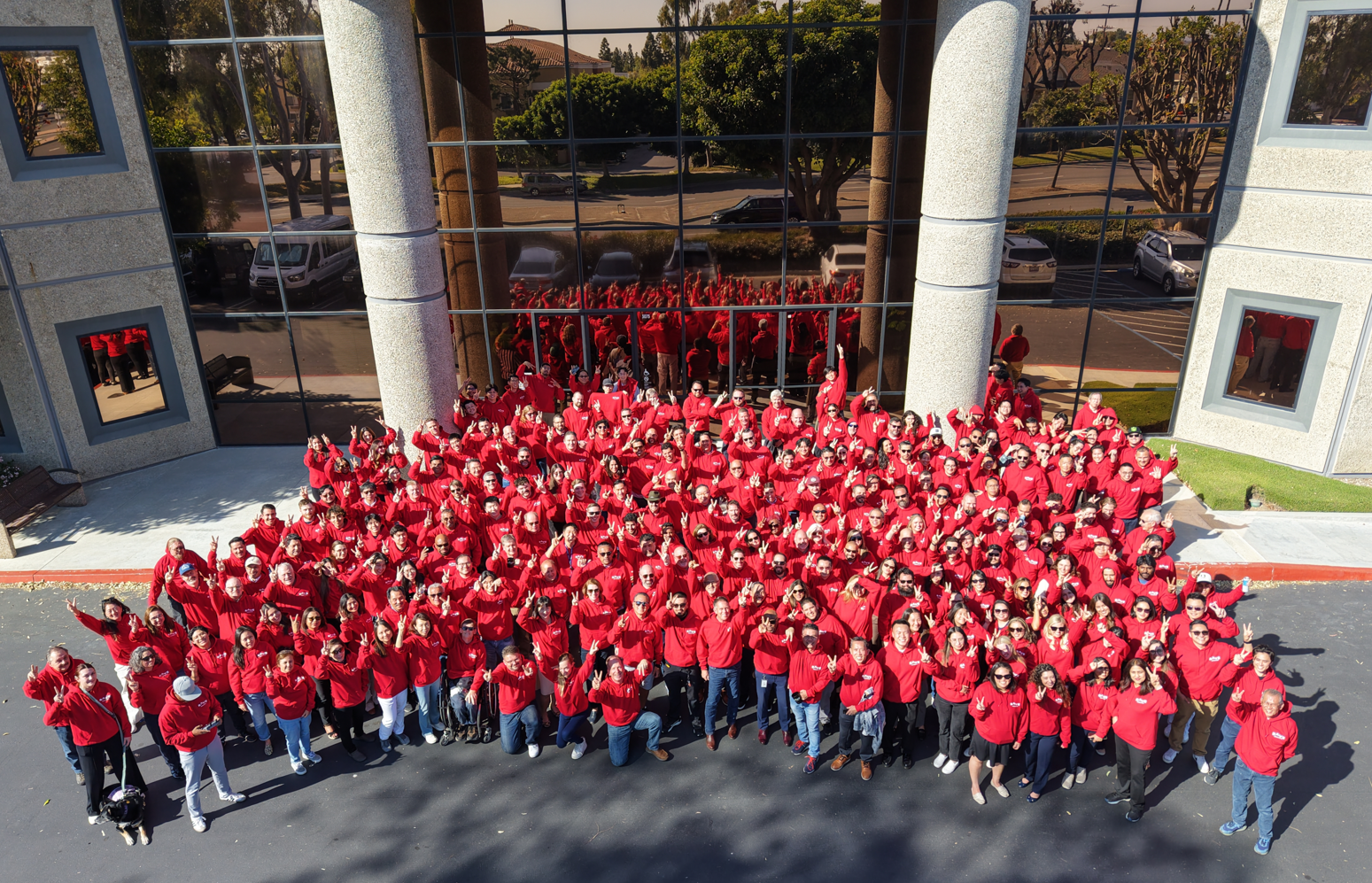 RAVE's team in front of the office building