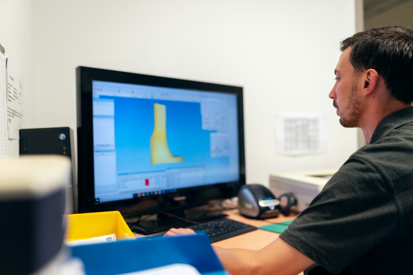 Engineer reviewing technical data on a computer workstation