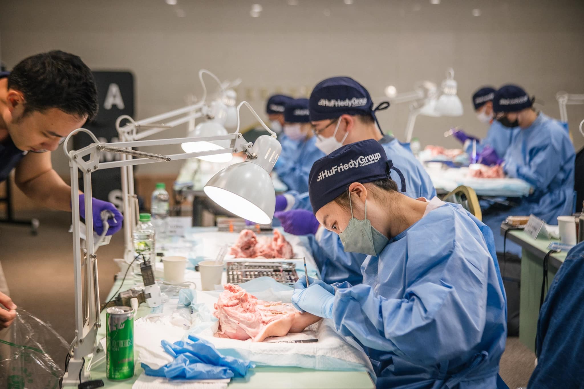 Participants practice dental techniques on tabletop models