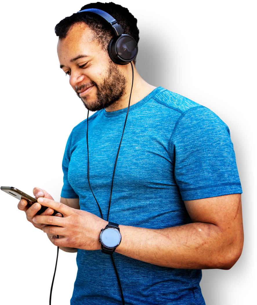 A man wearing headphones uses an app on his phone, listening to and Audiomob audio ad