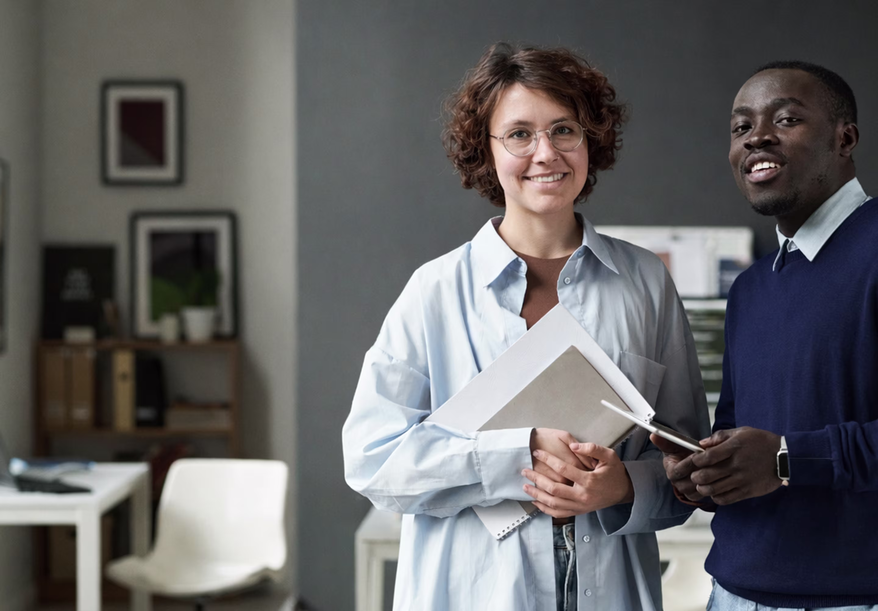 Two professionals engaged in a training session in an office