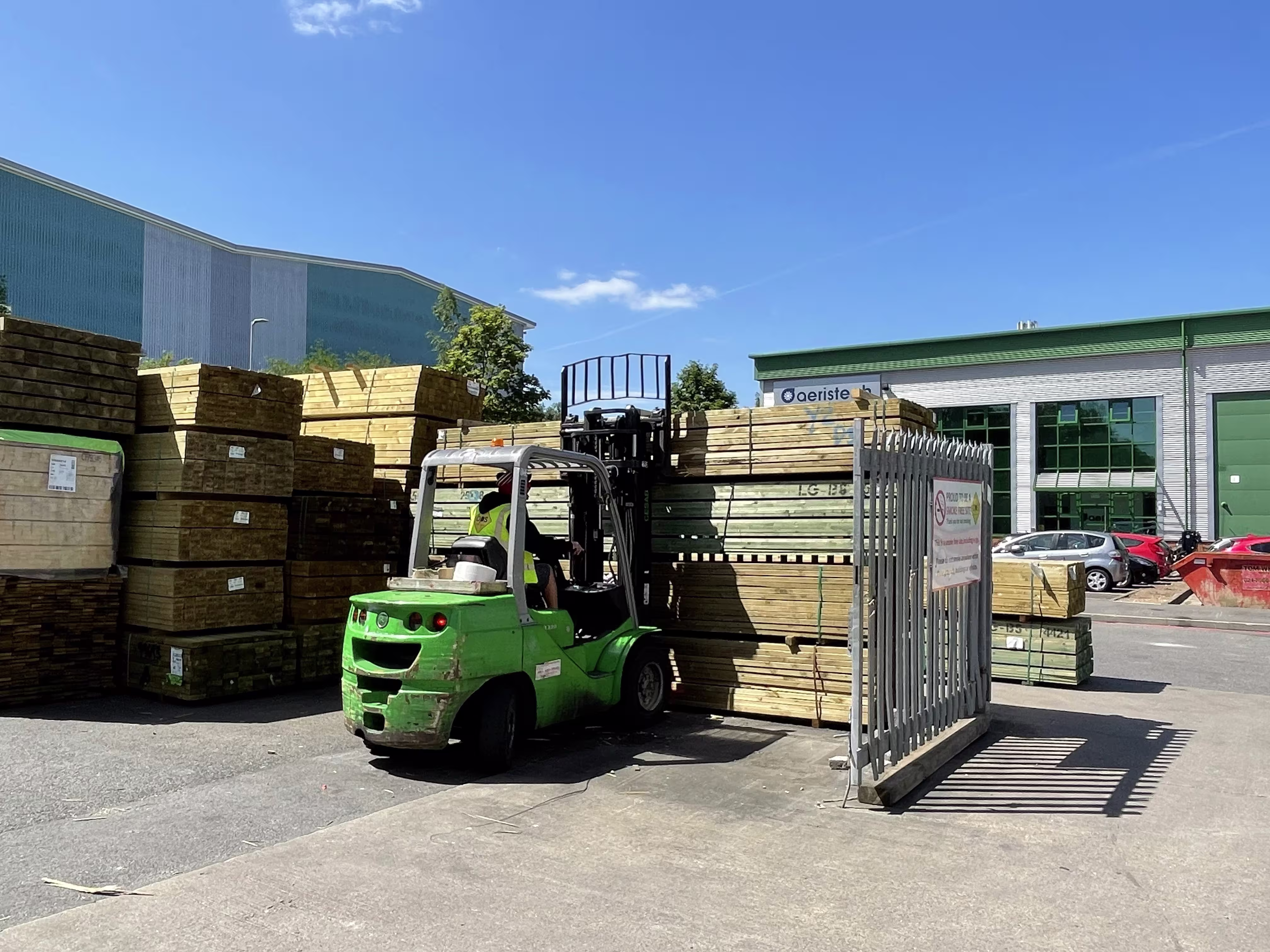 Forklift operator working in a builders merchant warehouse