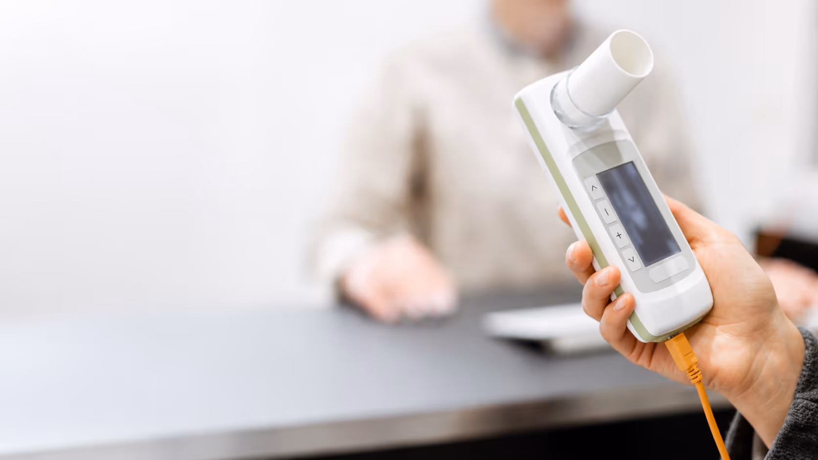 Person holding a measurement or testing device.