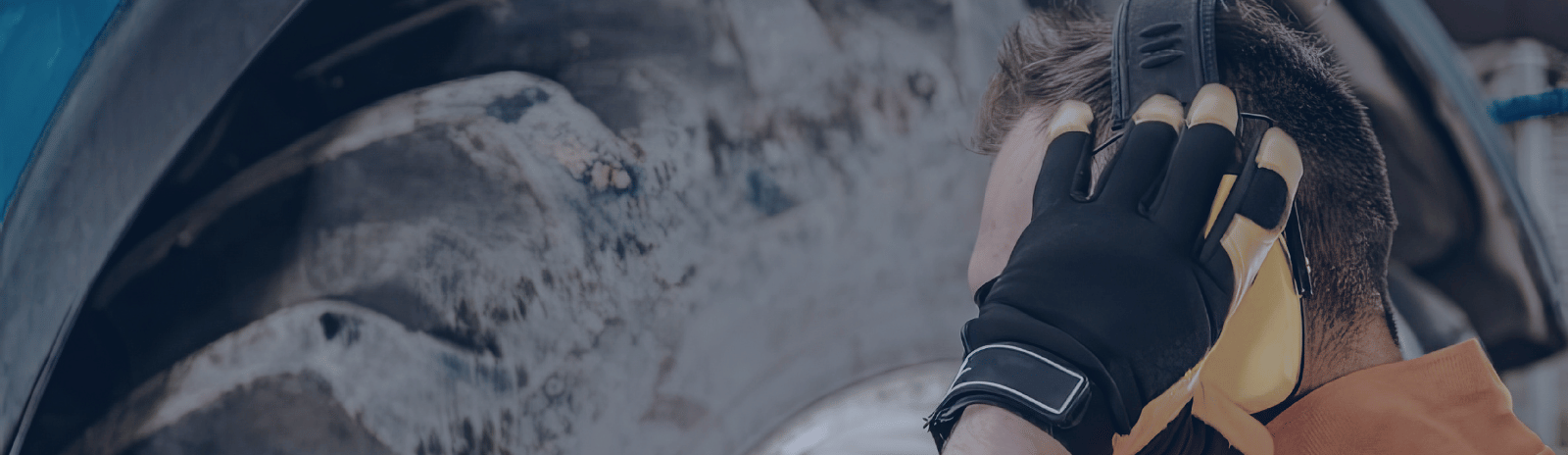 Person holding hearing protection equipment for noise assessment.