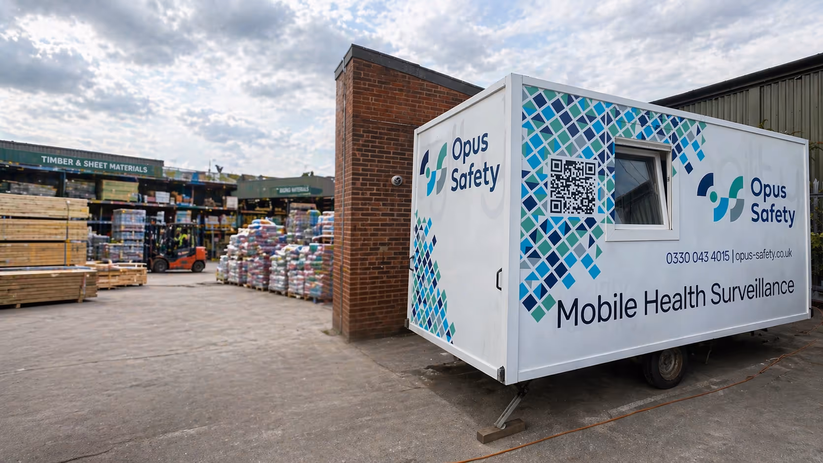 Opus Safety branded mobile health surveillance unit parked outside an industrial site.