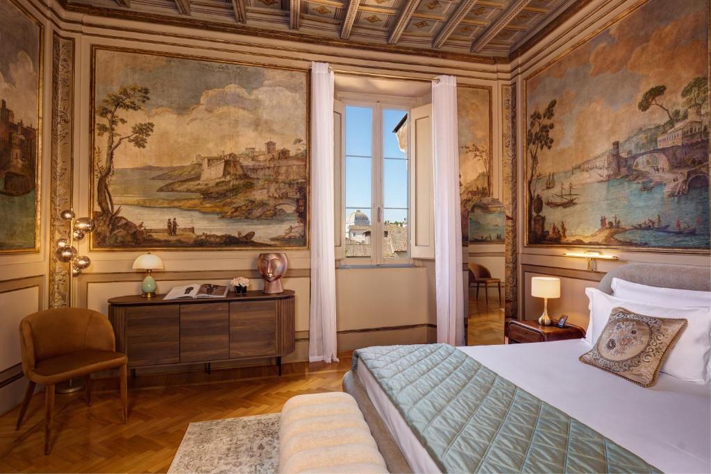 Elegant bedroom with large classical mural paintings on walls, a bed with blue quilt, wooden floor, window with white curtains, and modern furniture.