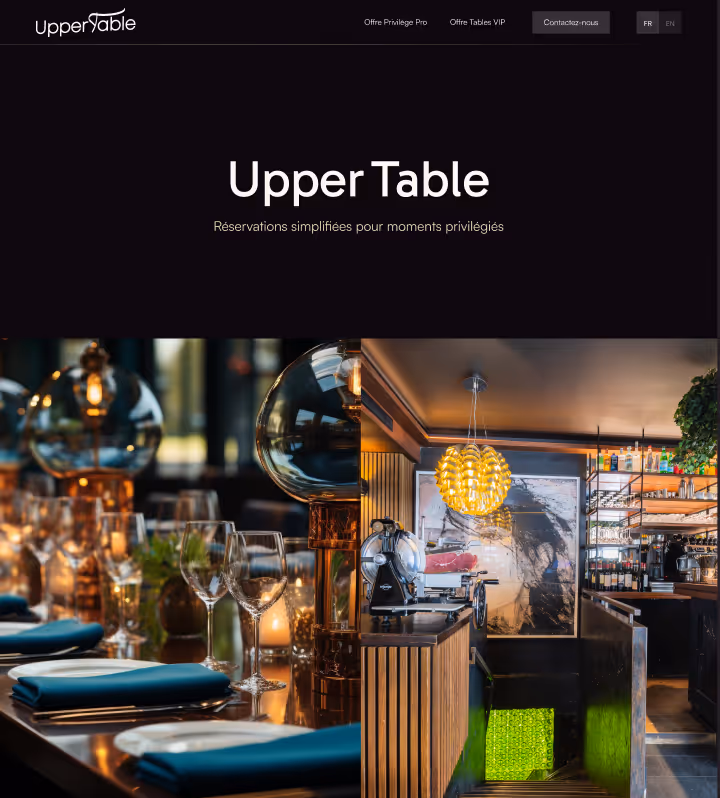Upscale restaurant interior with neatly set table, wine glasses, modern lighting, and a bar area.
