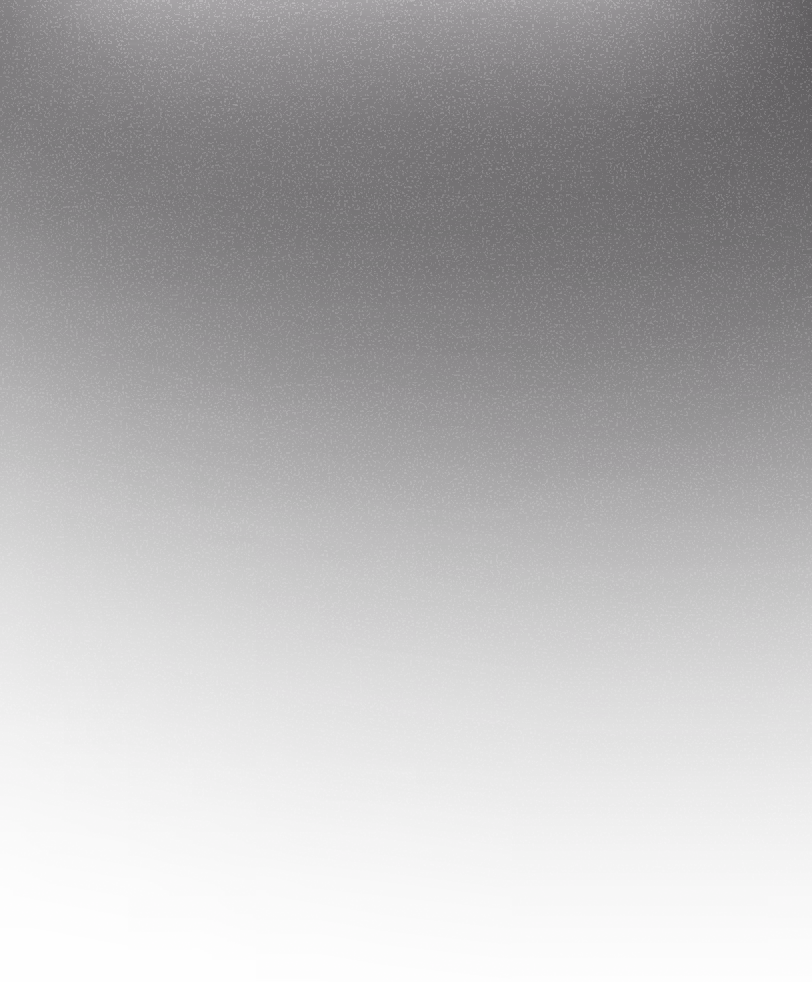 Dark gradient texture with a rough, scattered speckled pattern.