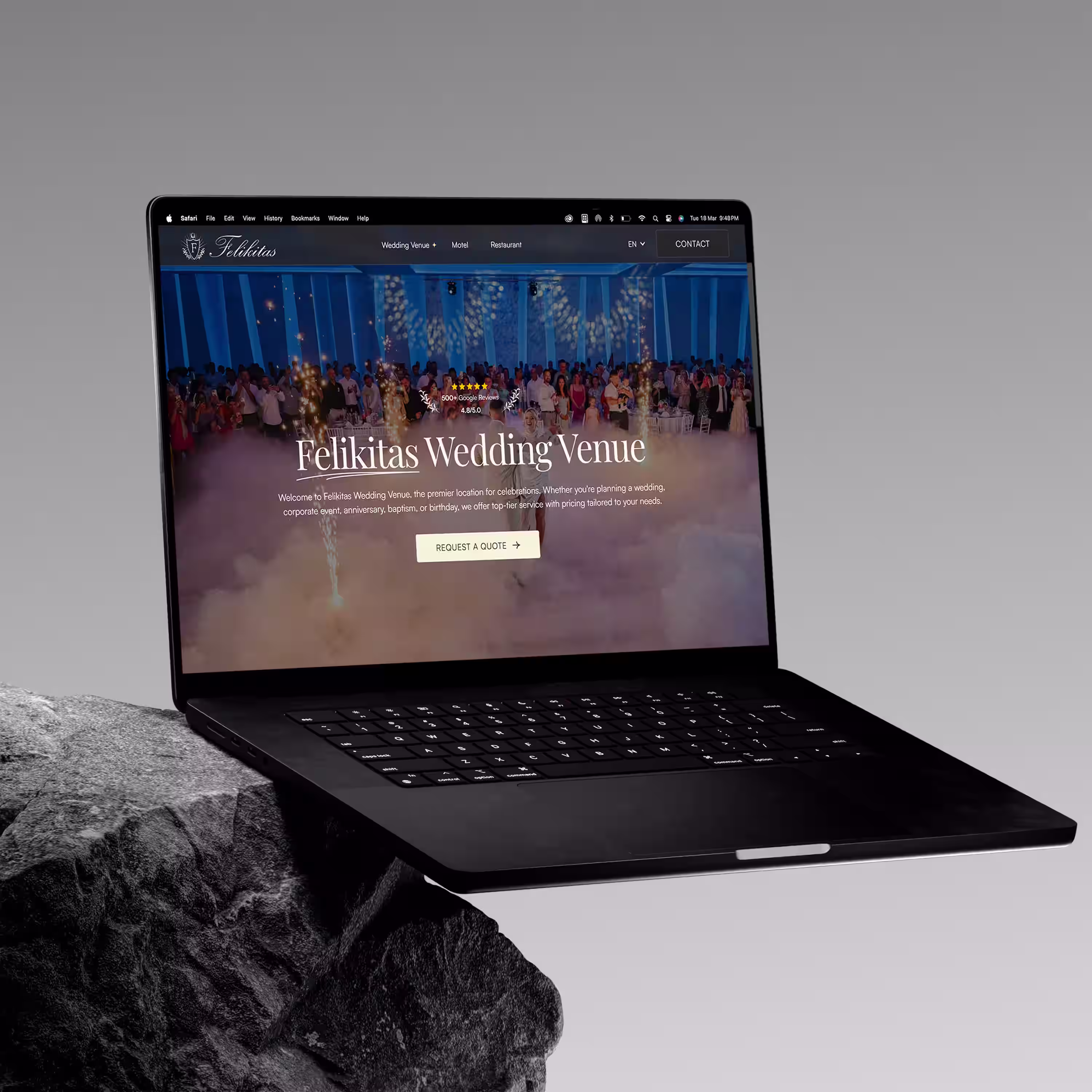 Laptop displaying Felikitas Wedding Venue website with a celebration scene featuring guests, sparklers, and fog effects.