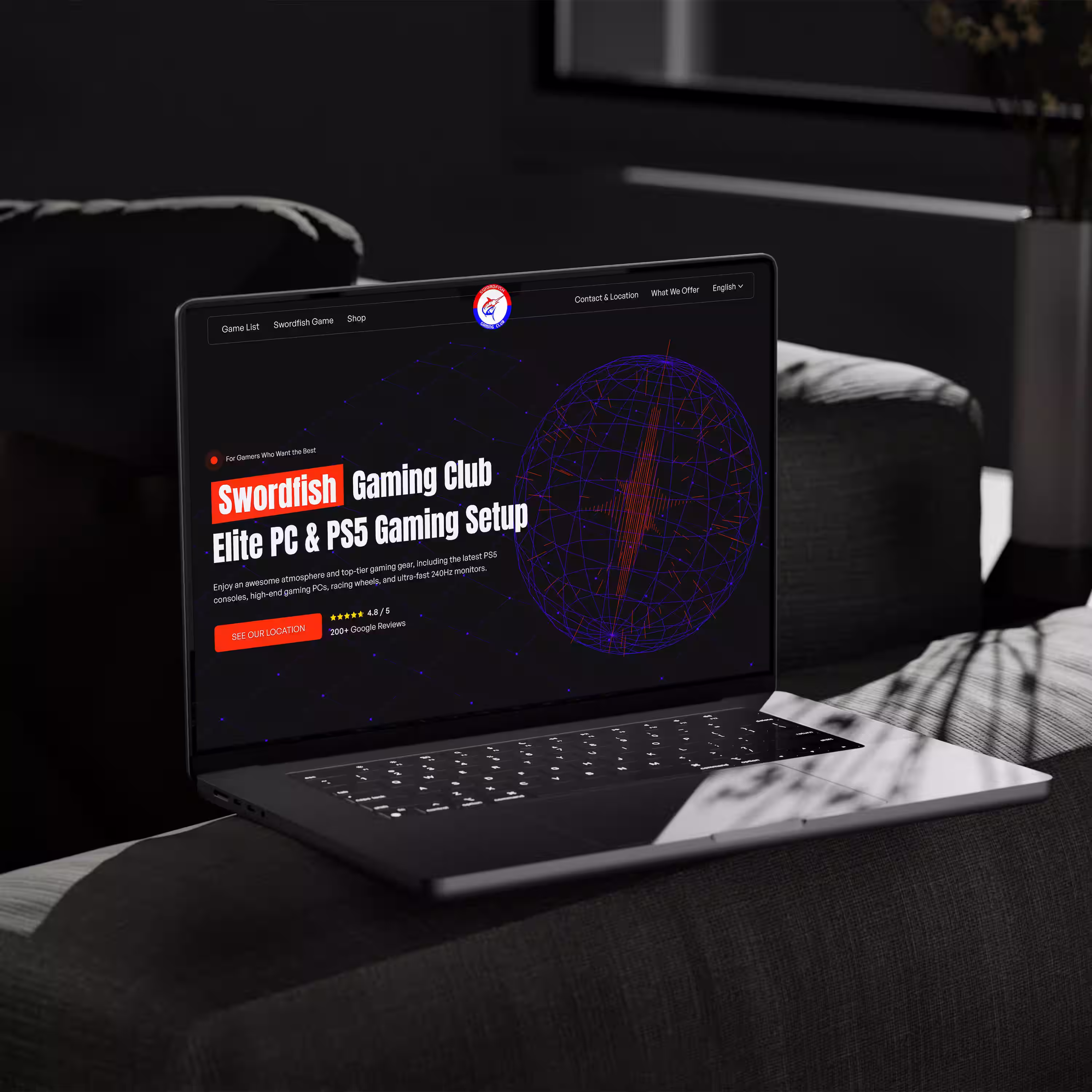 Laptop on a dark couch displaying the Swordfish Gaming Club website highlighting elite PC and PS5 gaming setups.