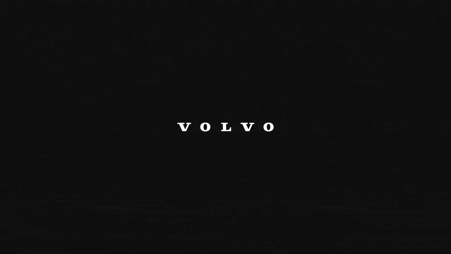 Volvo brand name in white serif font on solid black background.