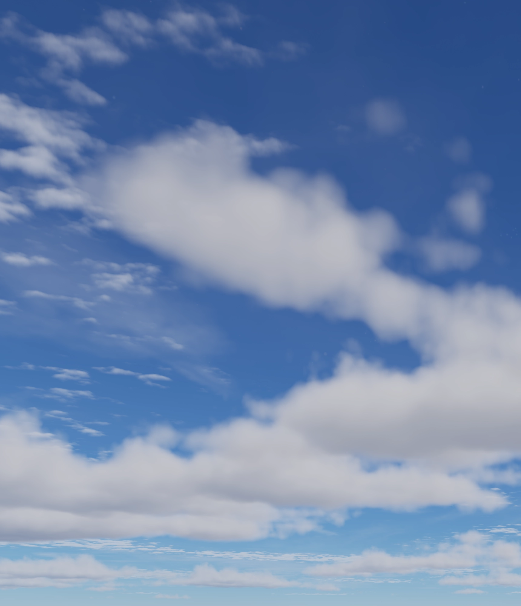 Niebieskie niebo z rozproszonymi białymi chmurami.