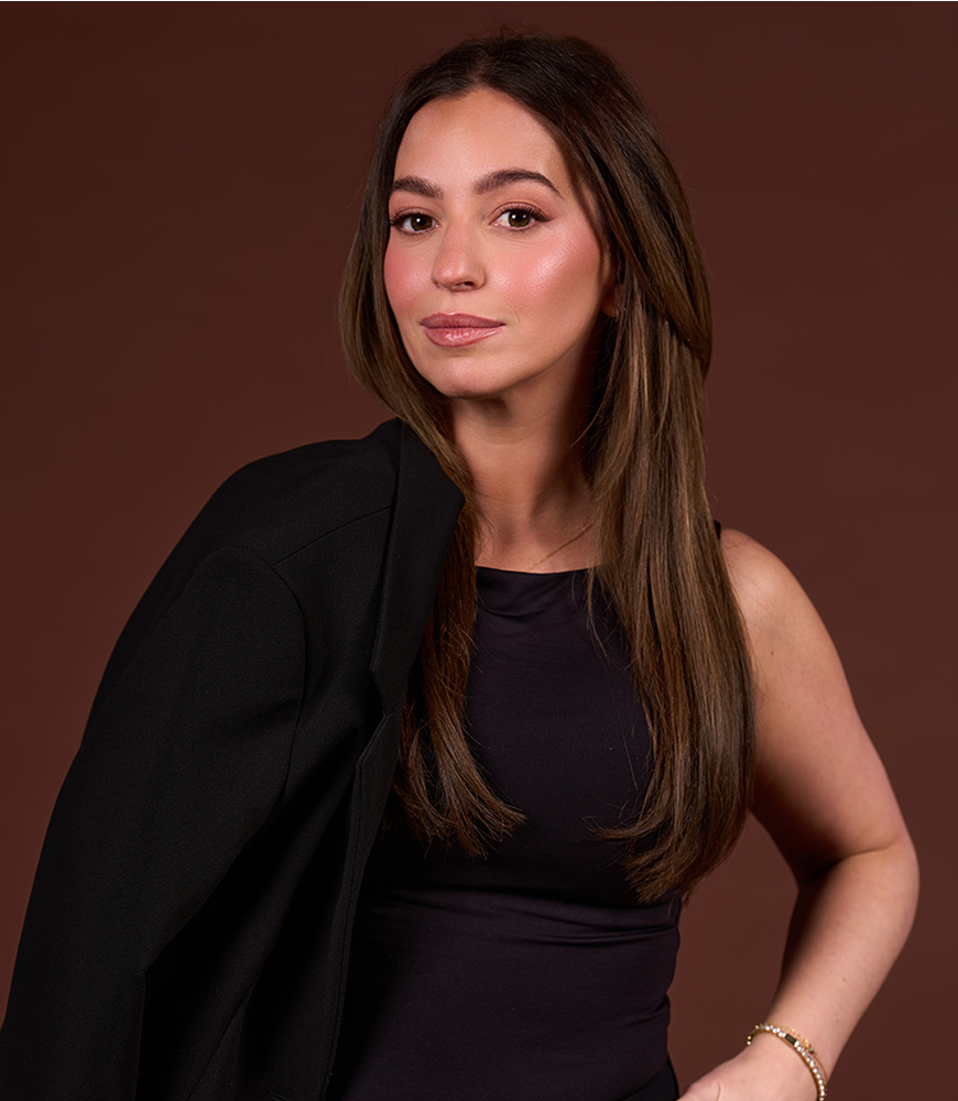 A professional headshot of Alex