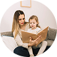 A little girl with mother is reading a book