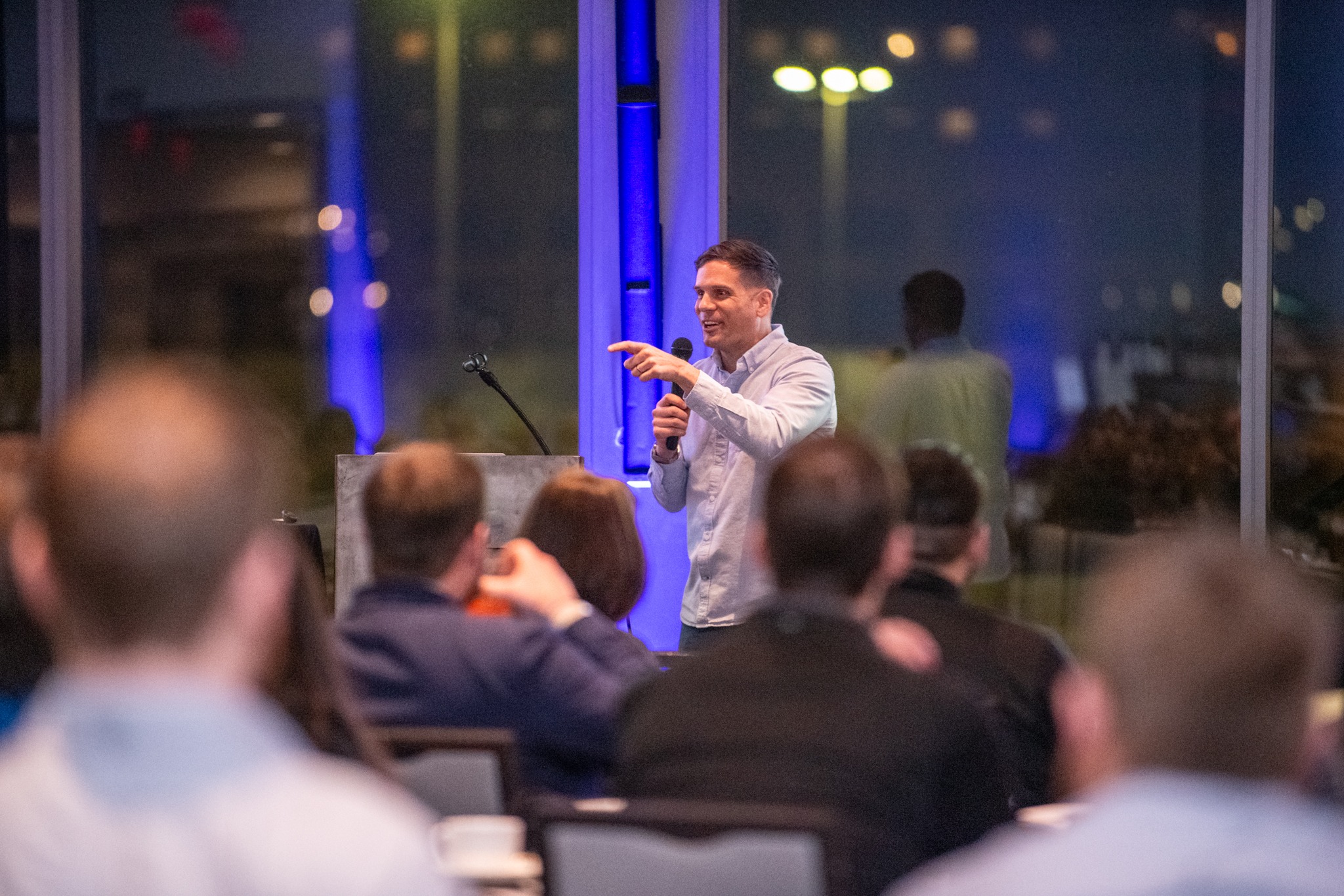 Zach Giglio engaging the audience at a speaking event