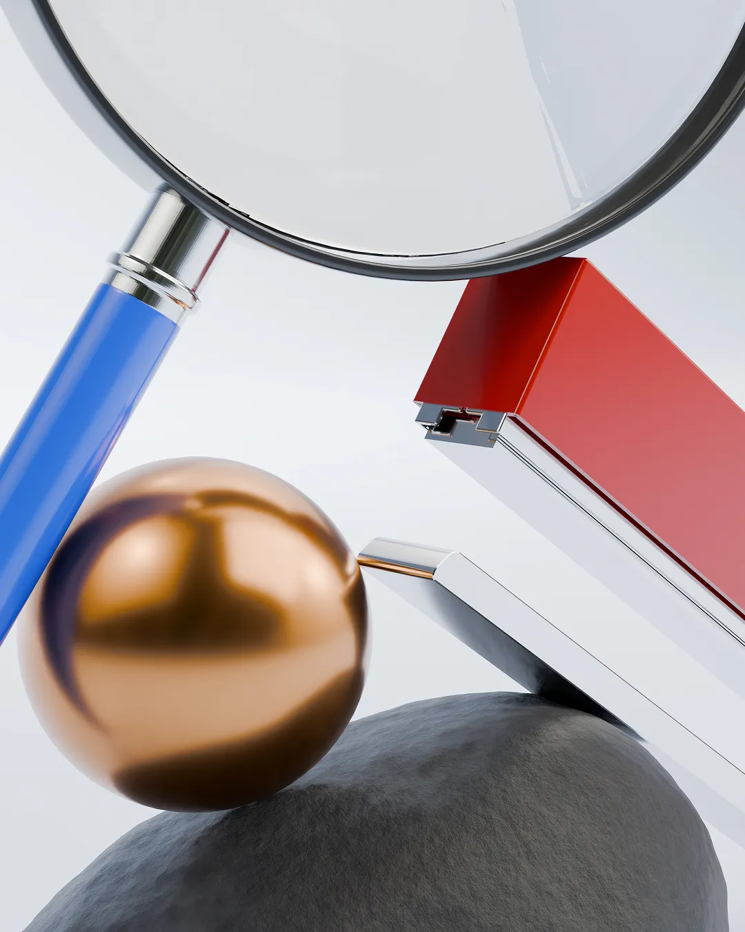 Close-up of a magnifying glass with a blue handle, a shiny bronze sphere, red and silver rectangular blocks, and a textured gray surface.