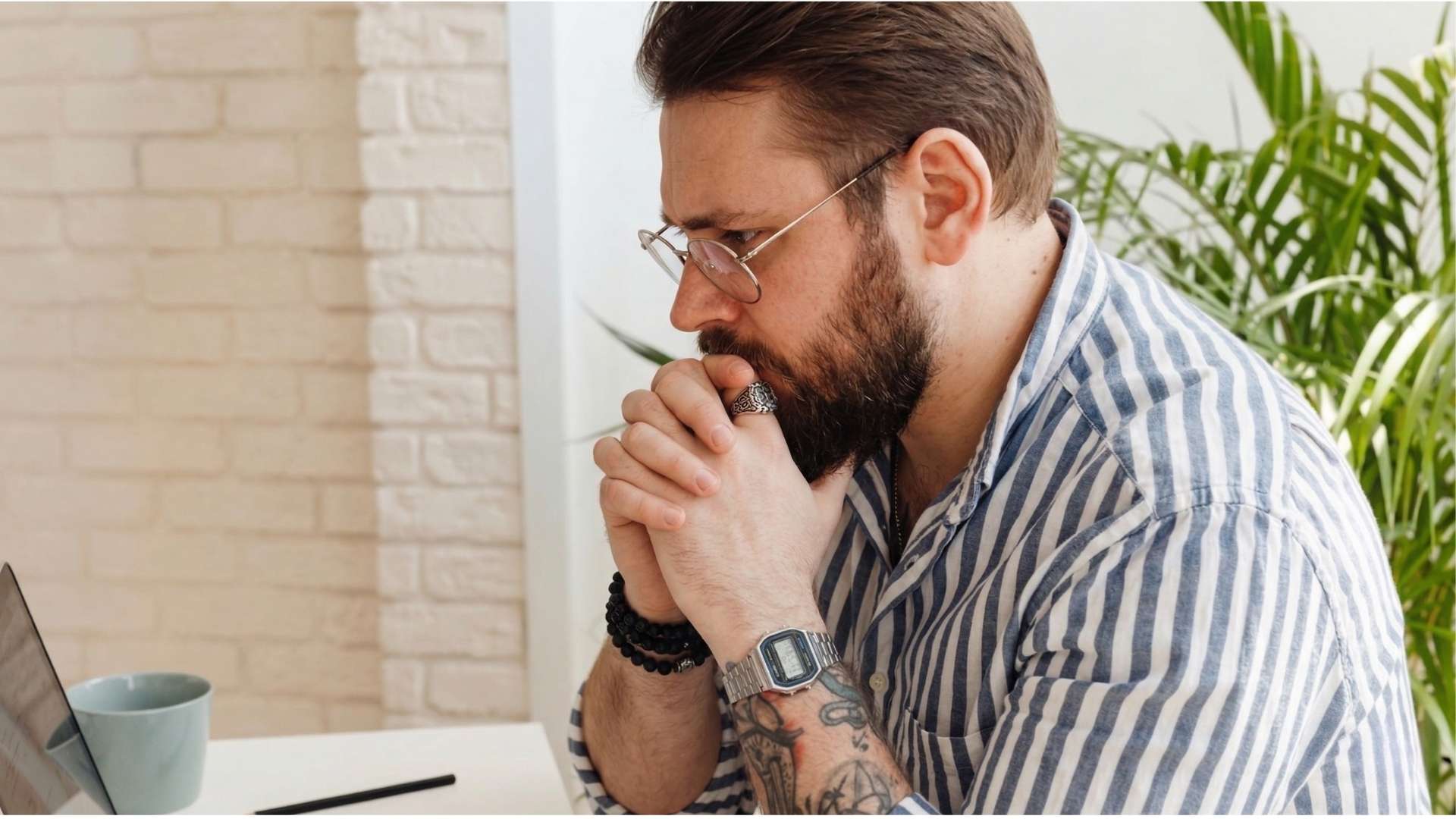 Person staring at screen with uncertainty