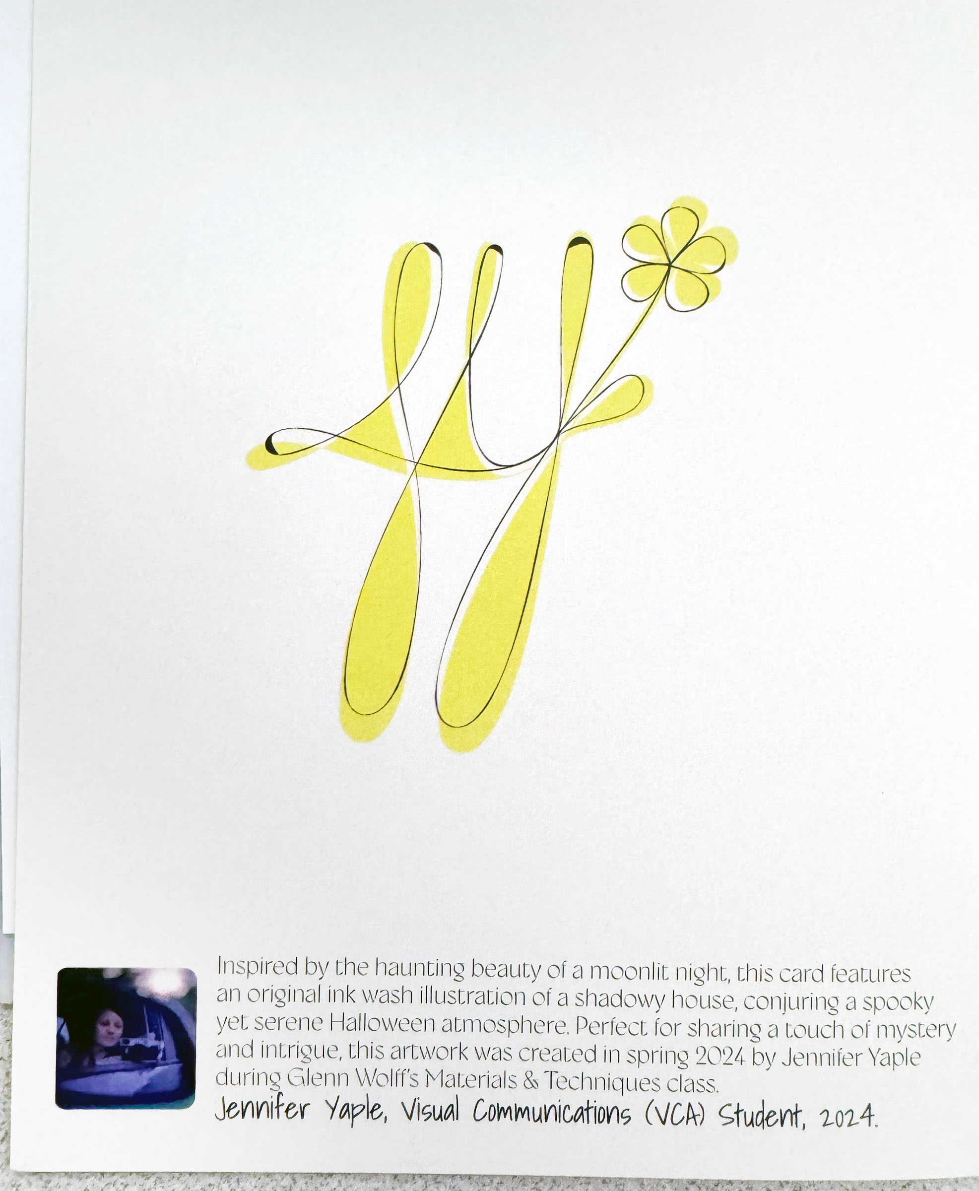 Colophon and initials mark shown on the back of the greeting card.
