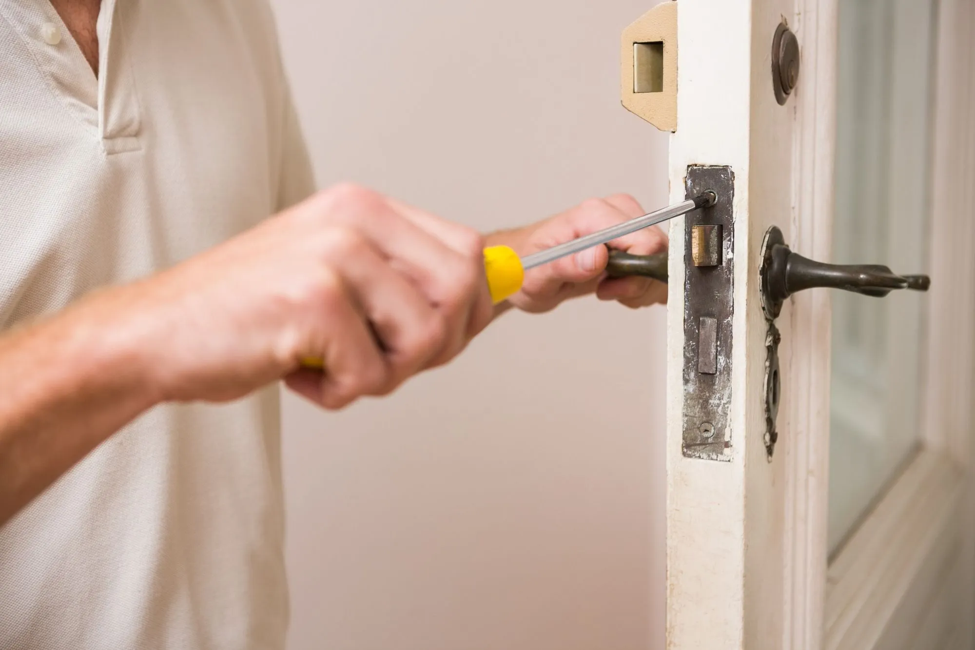 Screwing in a door jam | Justice Foundation & Crawlspace Repair