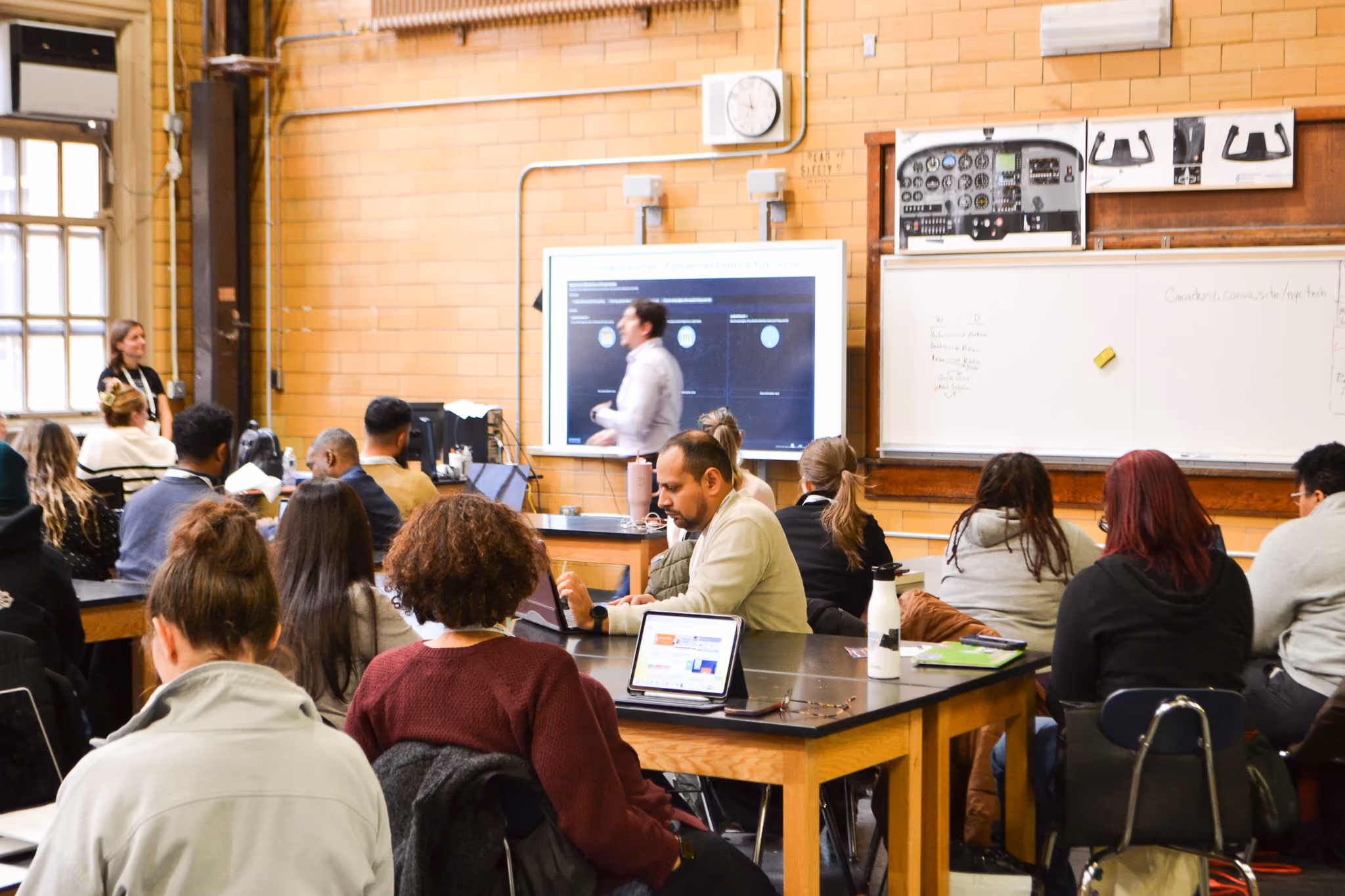 Adults attending a professional development session in a classroom
