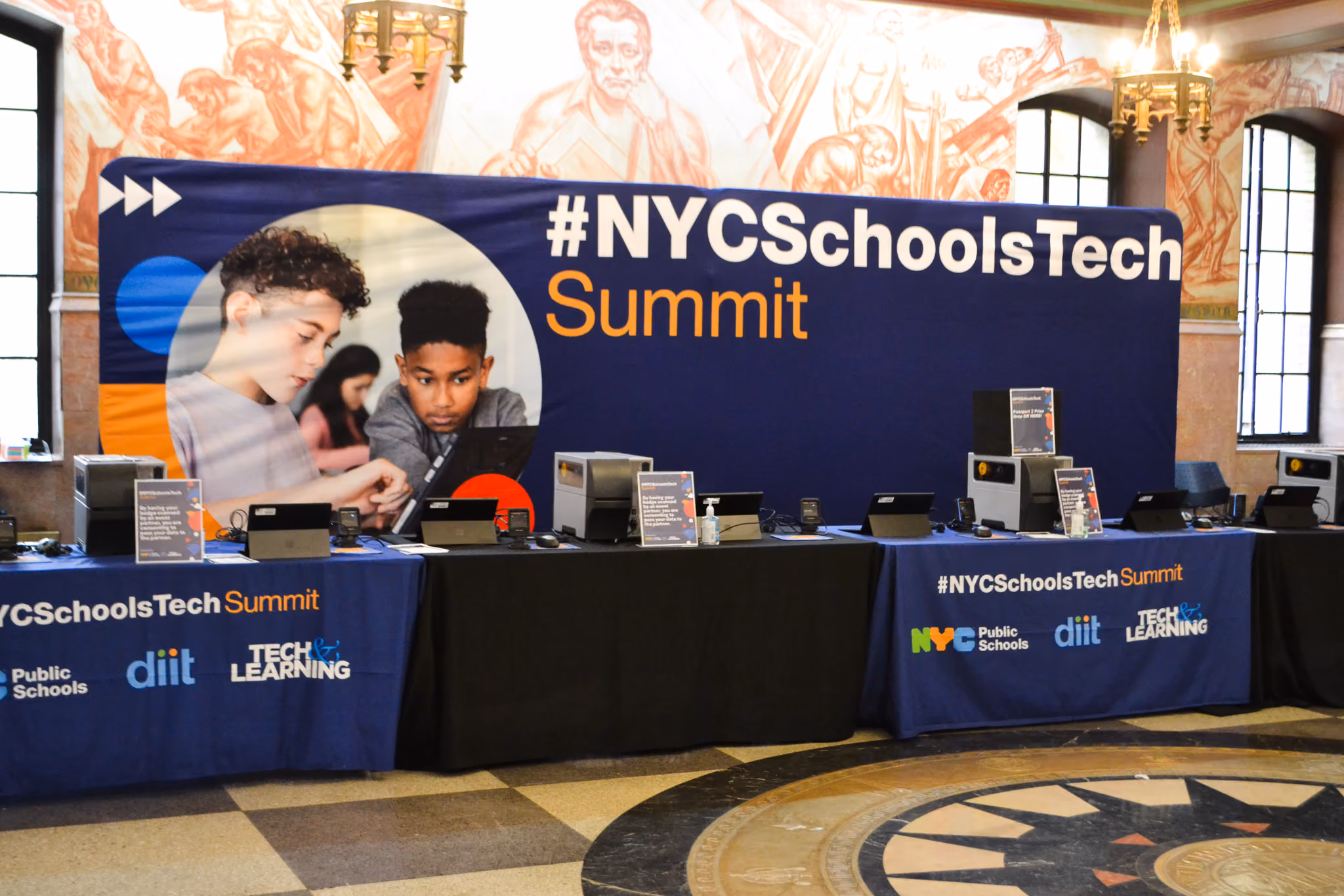 Registration tables set up at NYC Schools Tech Summit event