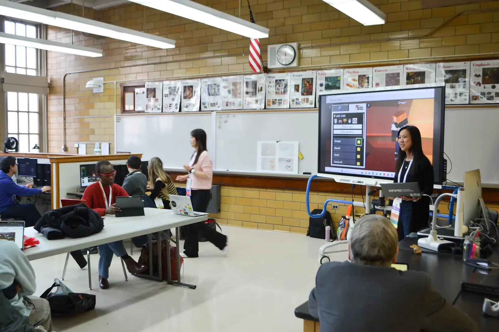 Teacher presenting on interactive smartboard to students in classroom
