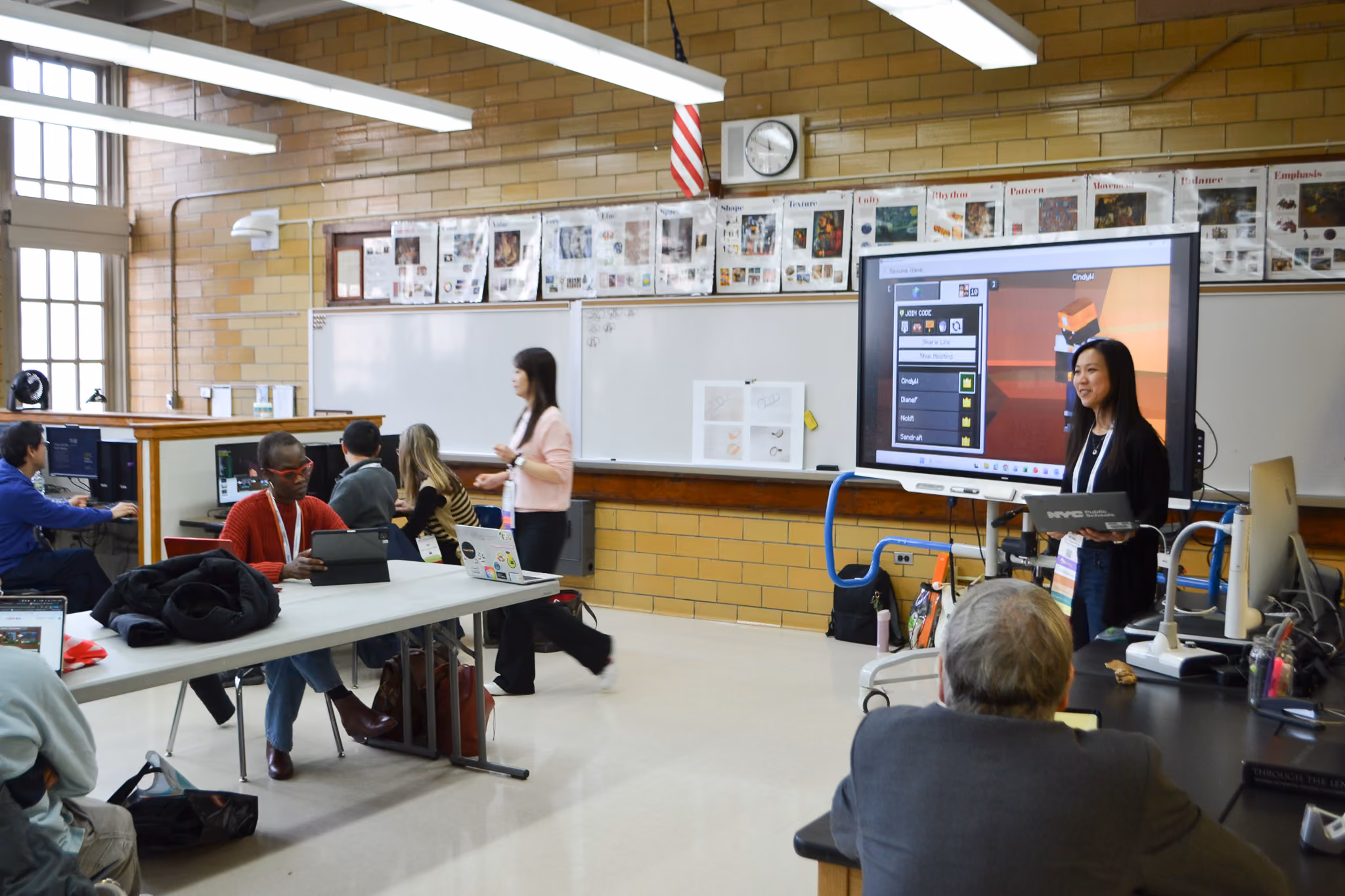 Teacher presenting on interactive smartboard to students in classroom