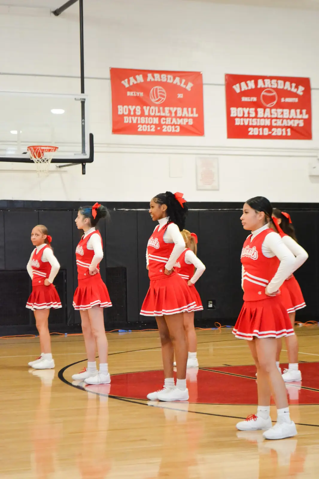 Van Arsdale cheerleaders standing in formation in school gymnasium