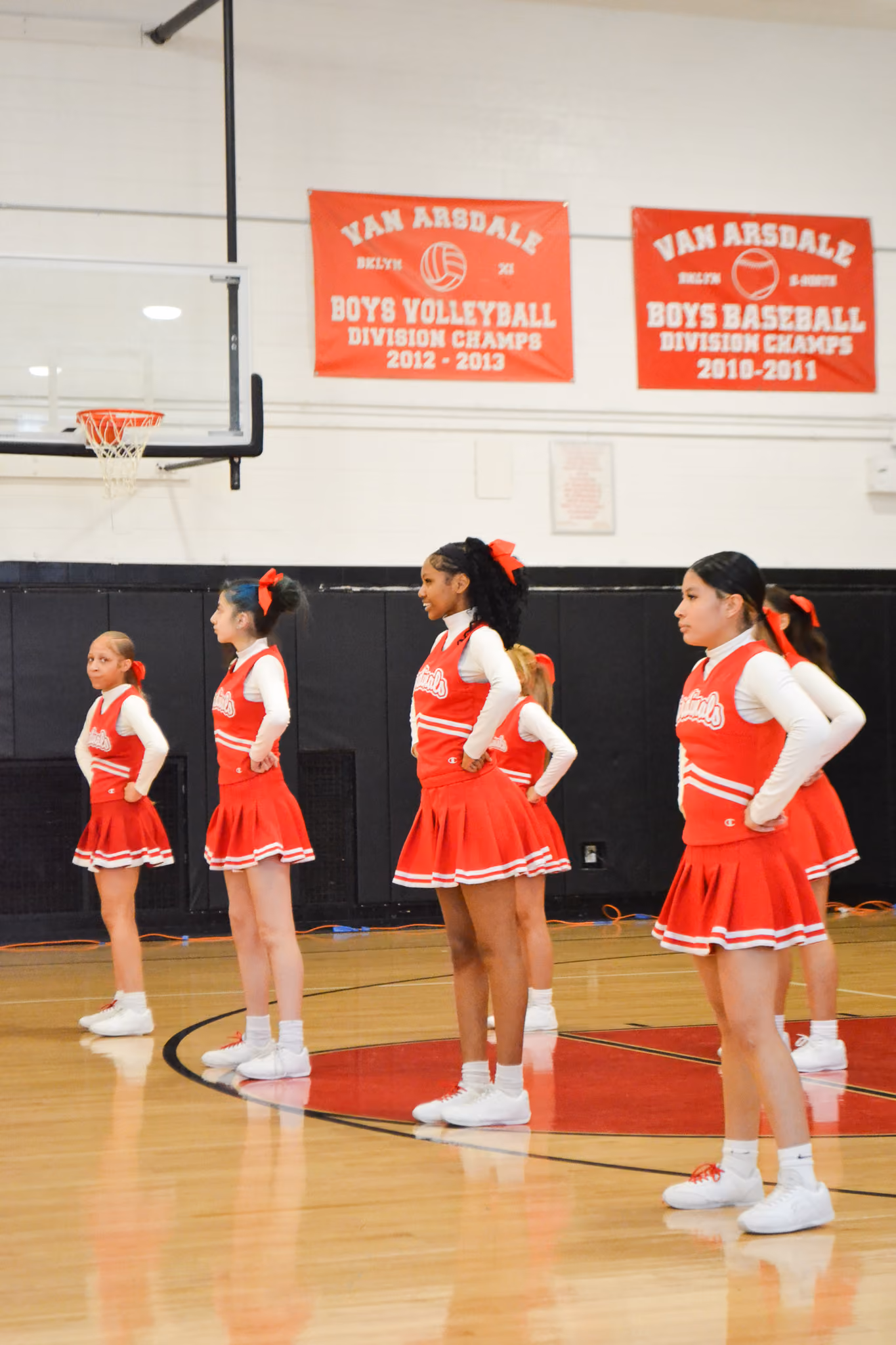 Van Arsdale cheerleaders standing in formation in school gymnasium