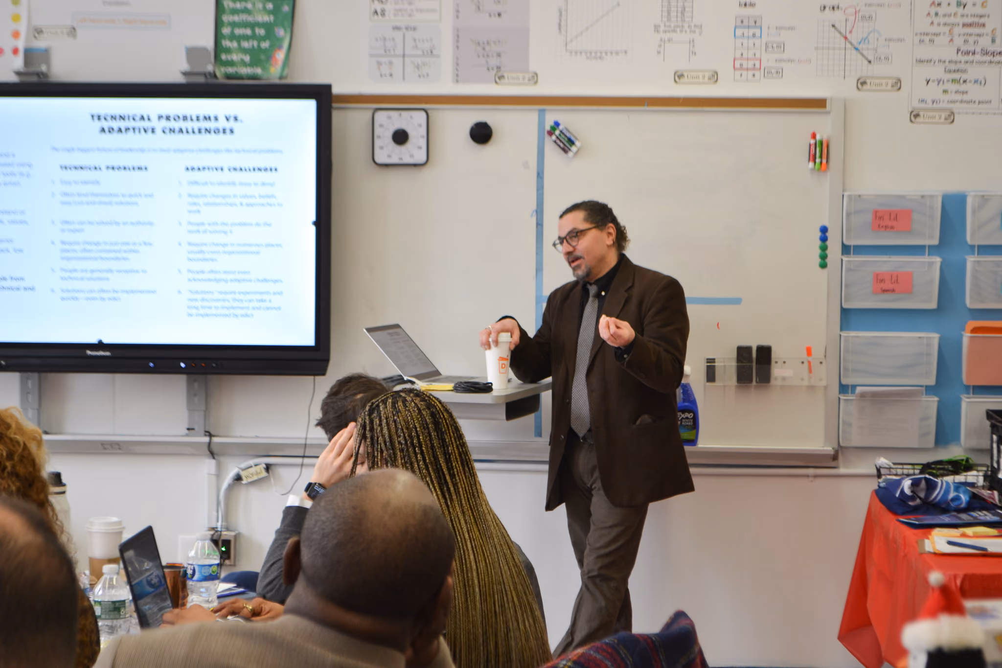 Teacher presenting technical problems versus adaptive challenges to staff