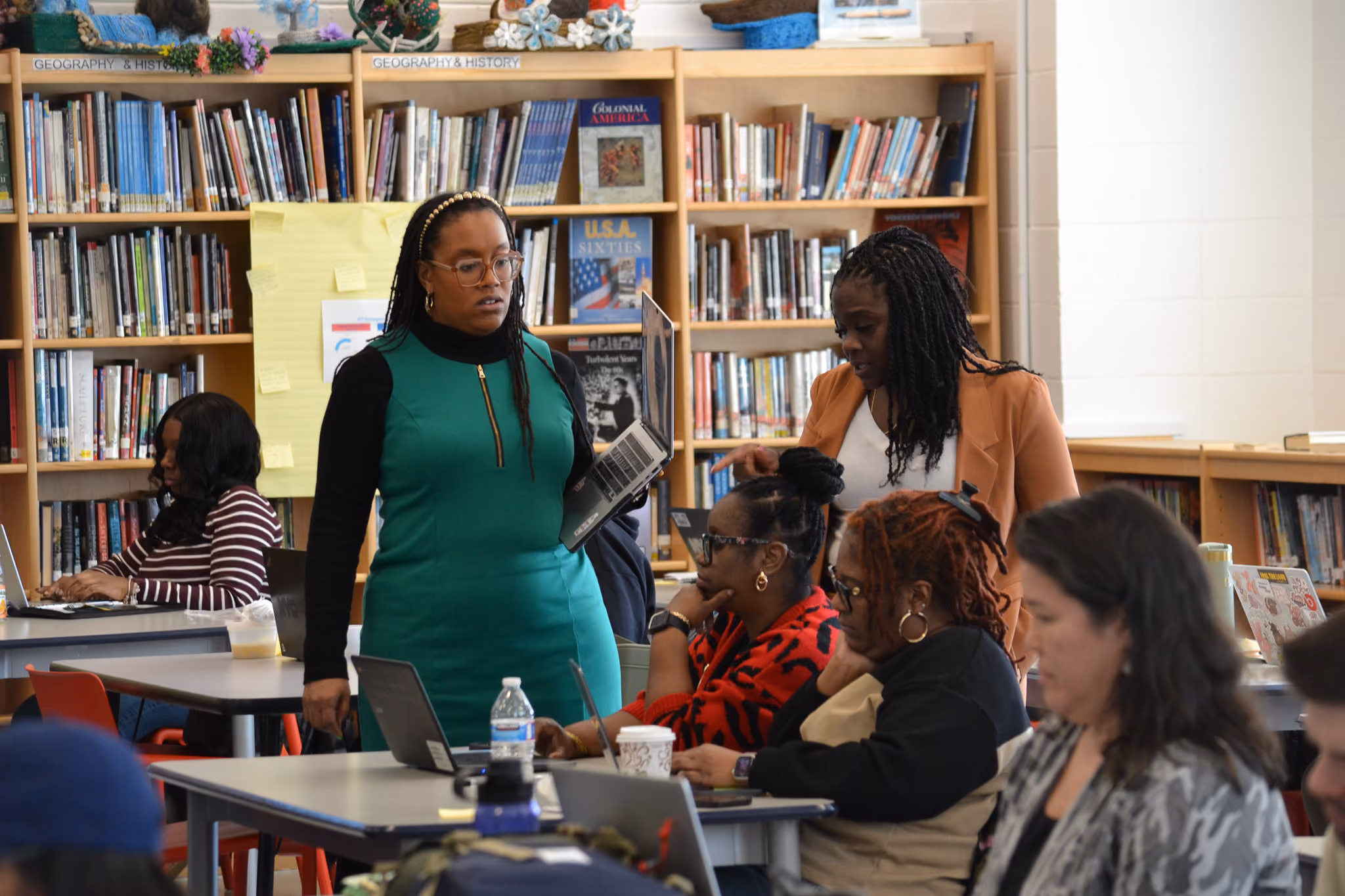 Teacher leading a professional development session in school library