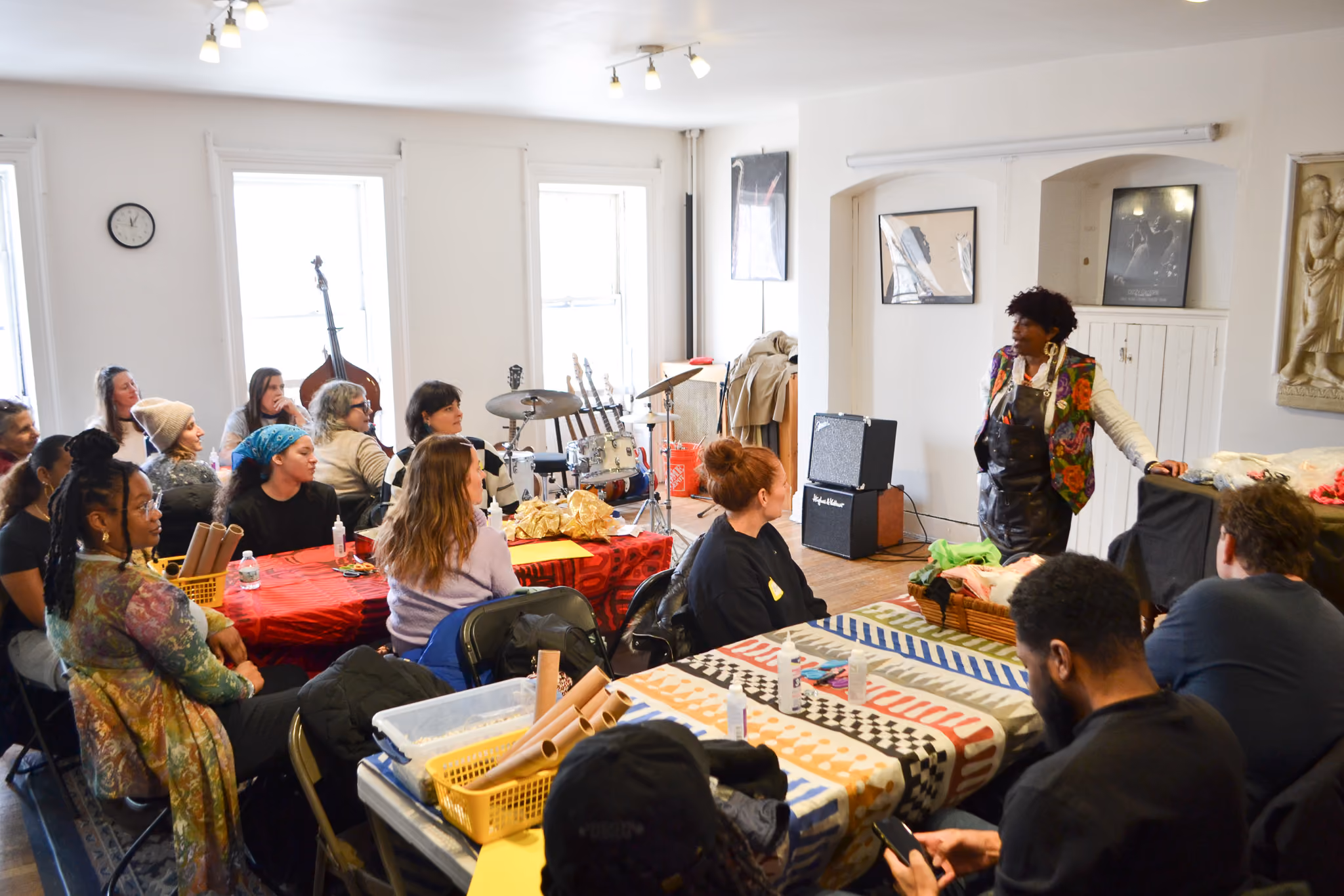 Instructor leading a hands-on workshop for seated adult participants
