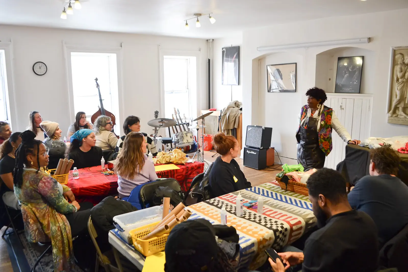 Instructor leading a hands-on workshop for seated adult participants