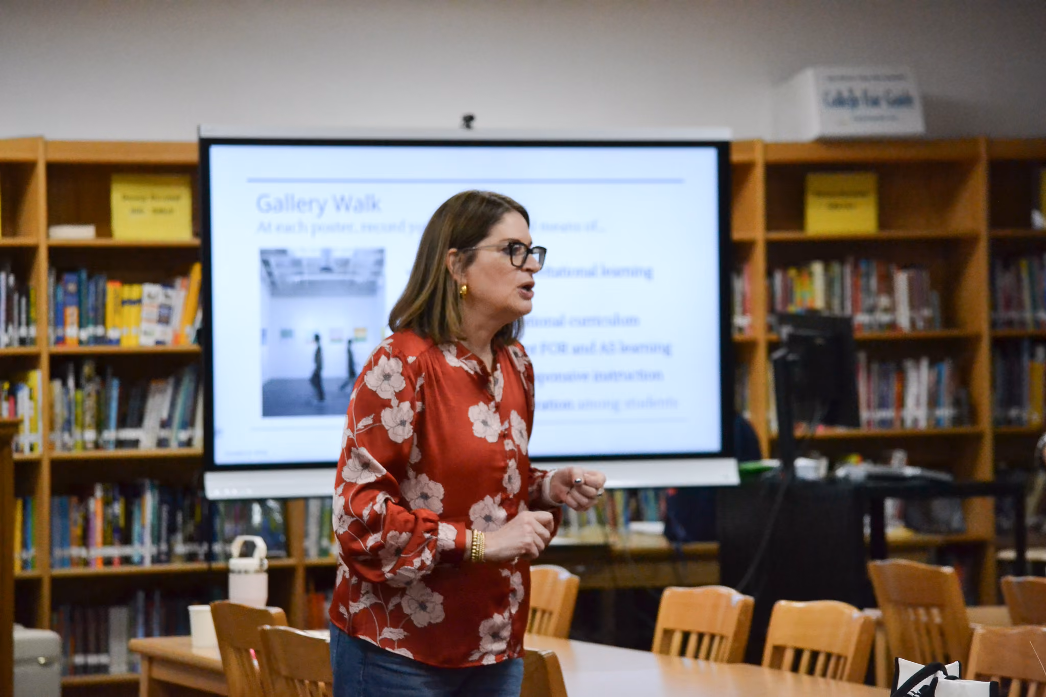 Teacher presenting Gallery Walk lesson in school library