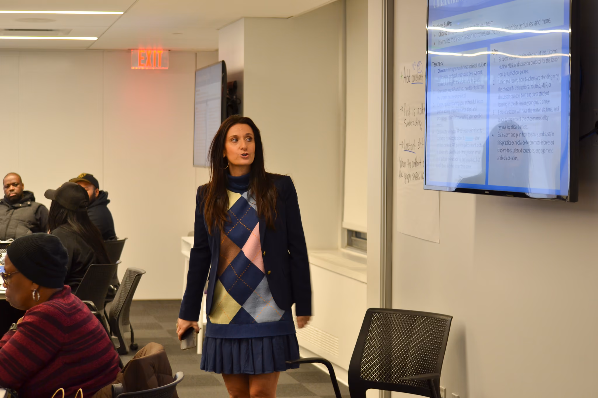 Teacher presenting to staff during a professional development session