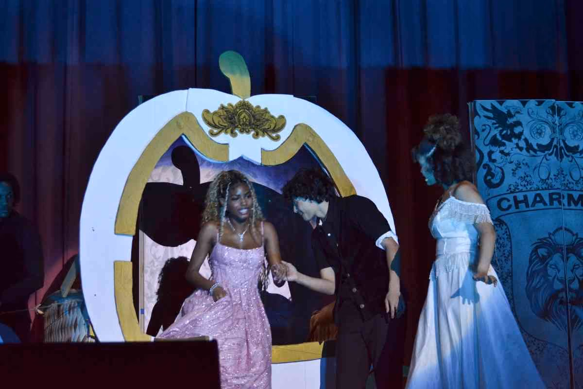 Students perform Cinderella school musical on stage in costume