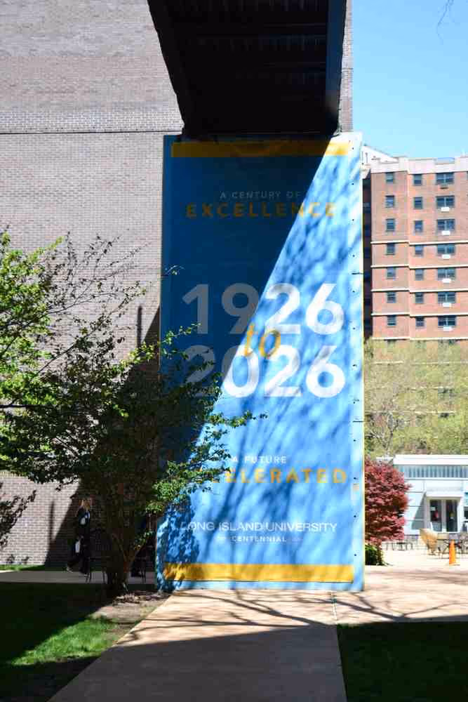 Long Island University centennial banner reading 1926 to 2026 on campus
