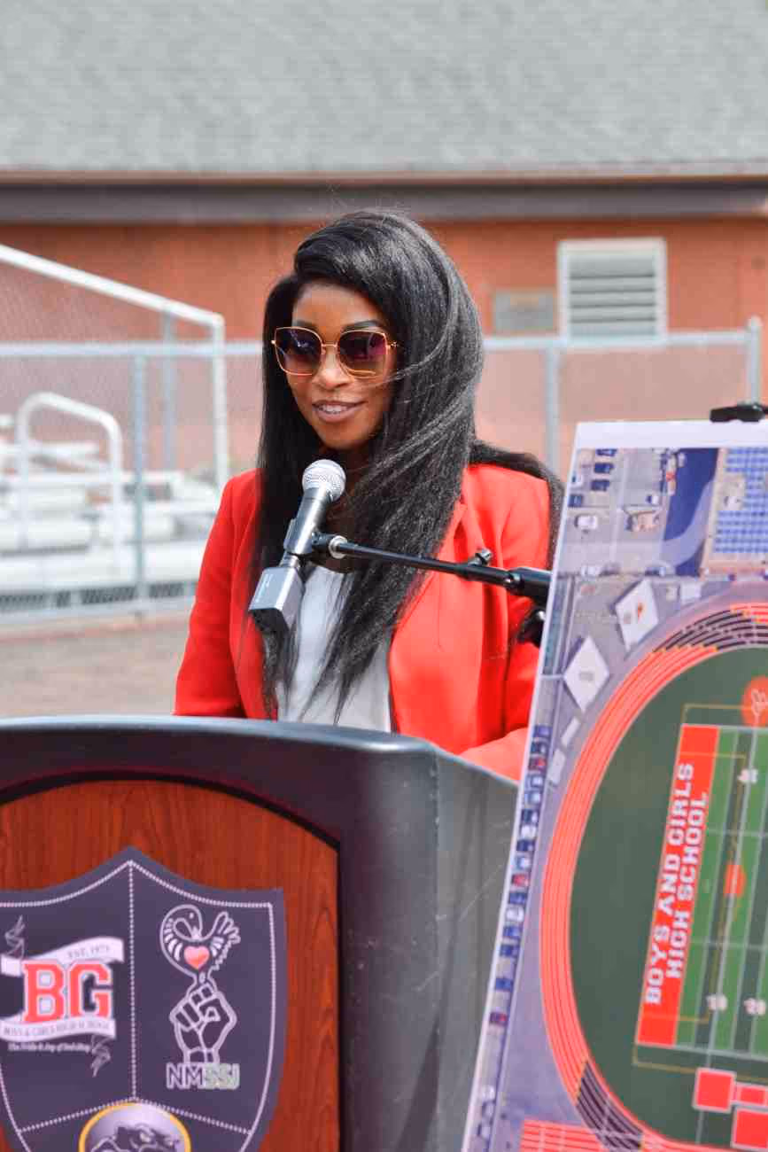 Speaker at Boys and Girls High School athletic field announcement podium