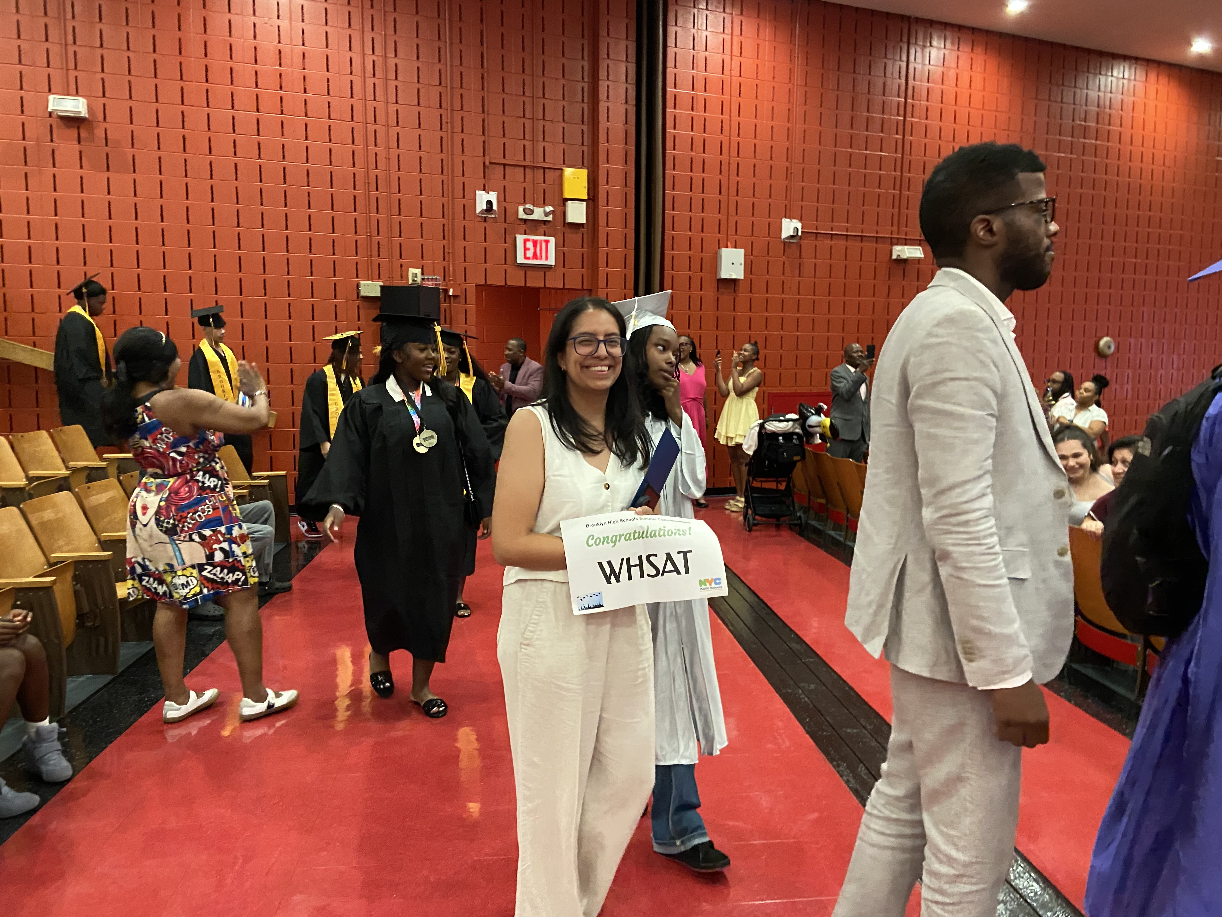 WHSAT graduates processing through auditorium during graduation ceremony
