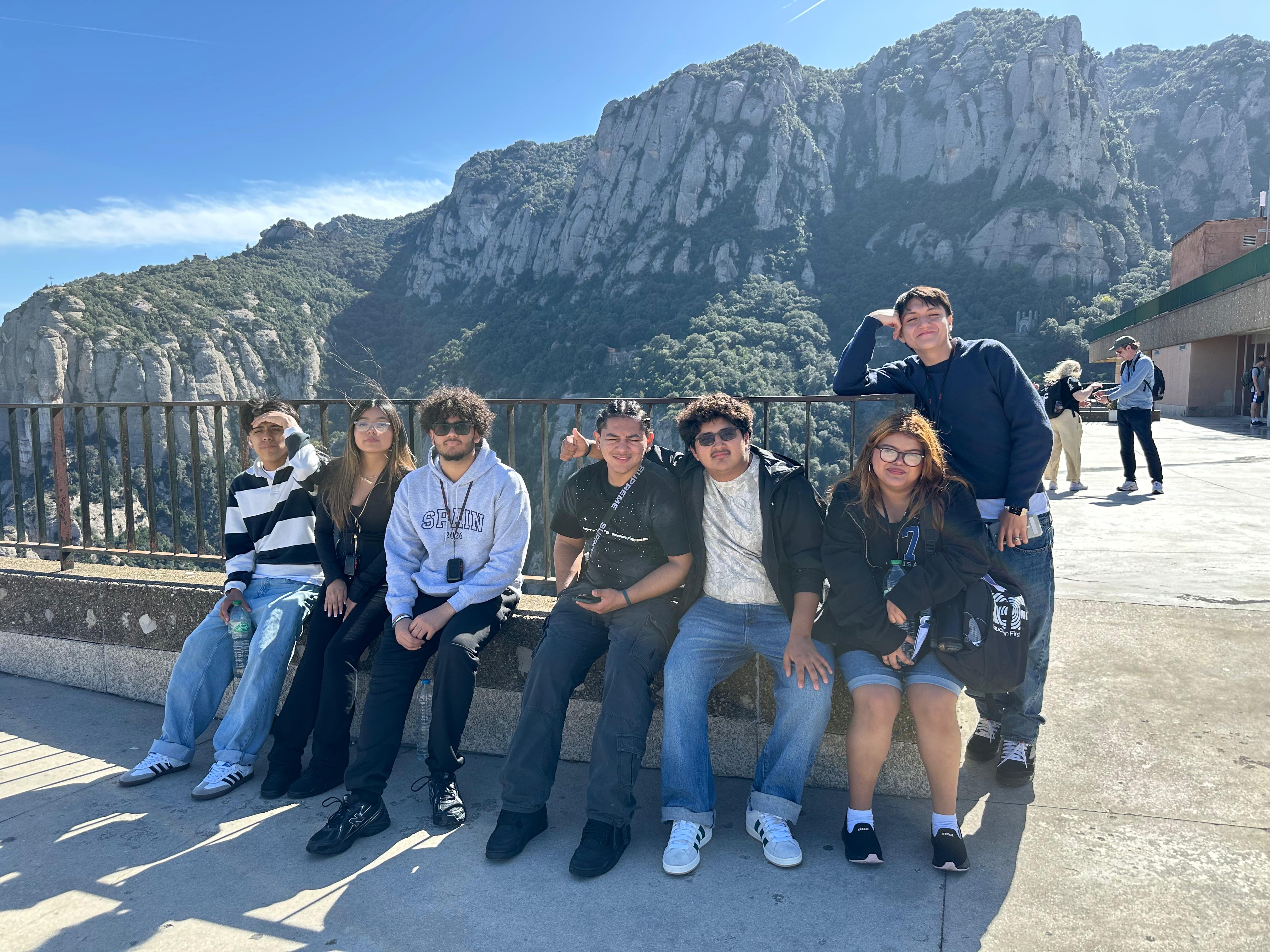 Students posing together in front of rocky mountain landscape in Spain