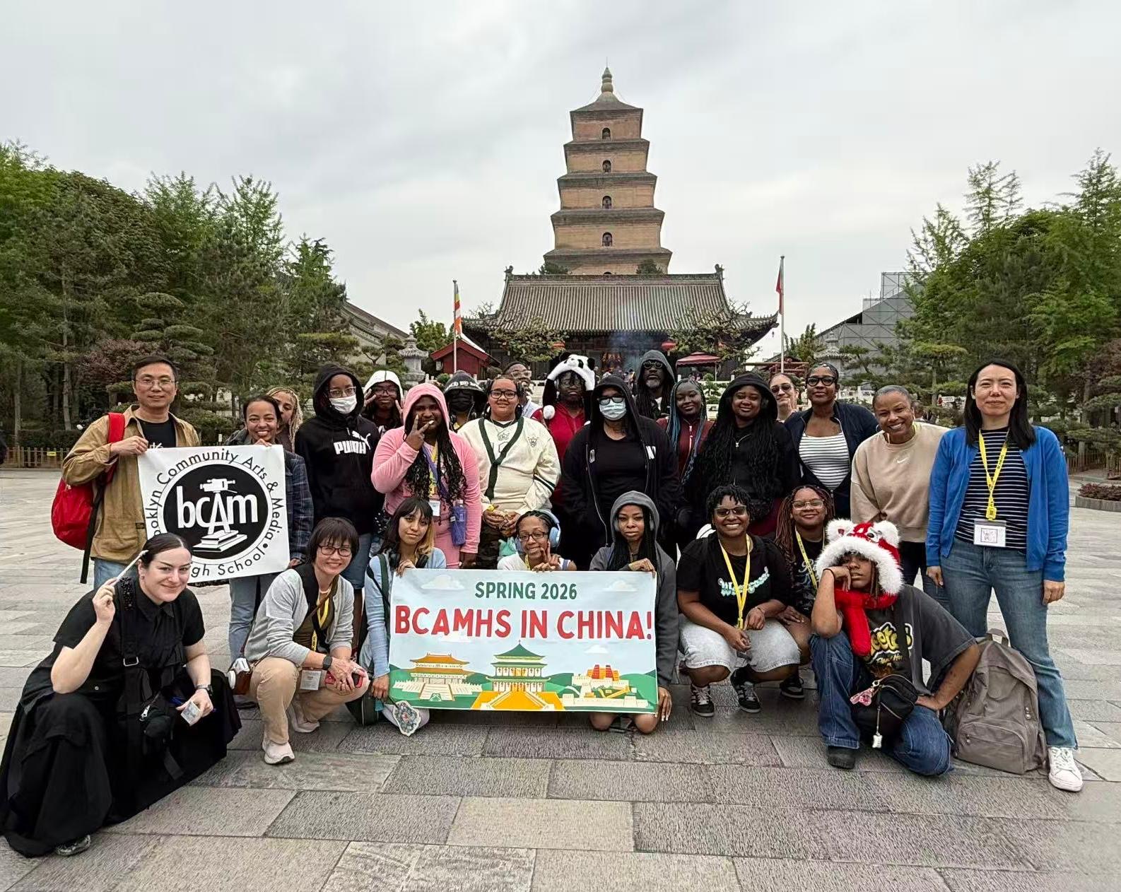 BCAMHS students and staff posing at Chinese pagoda on Spring 2026 trip